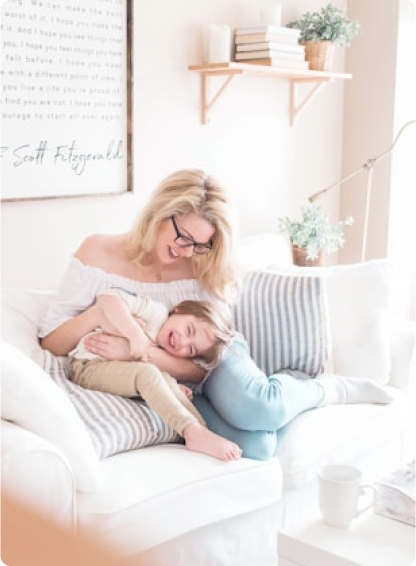 Woman Holding Child Smiling