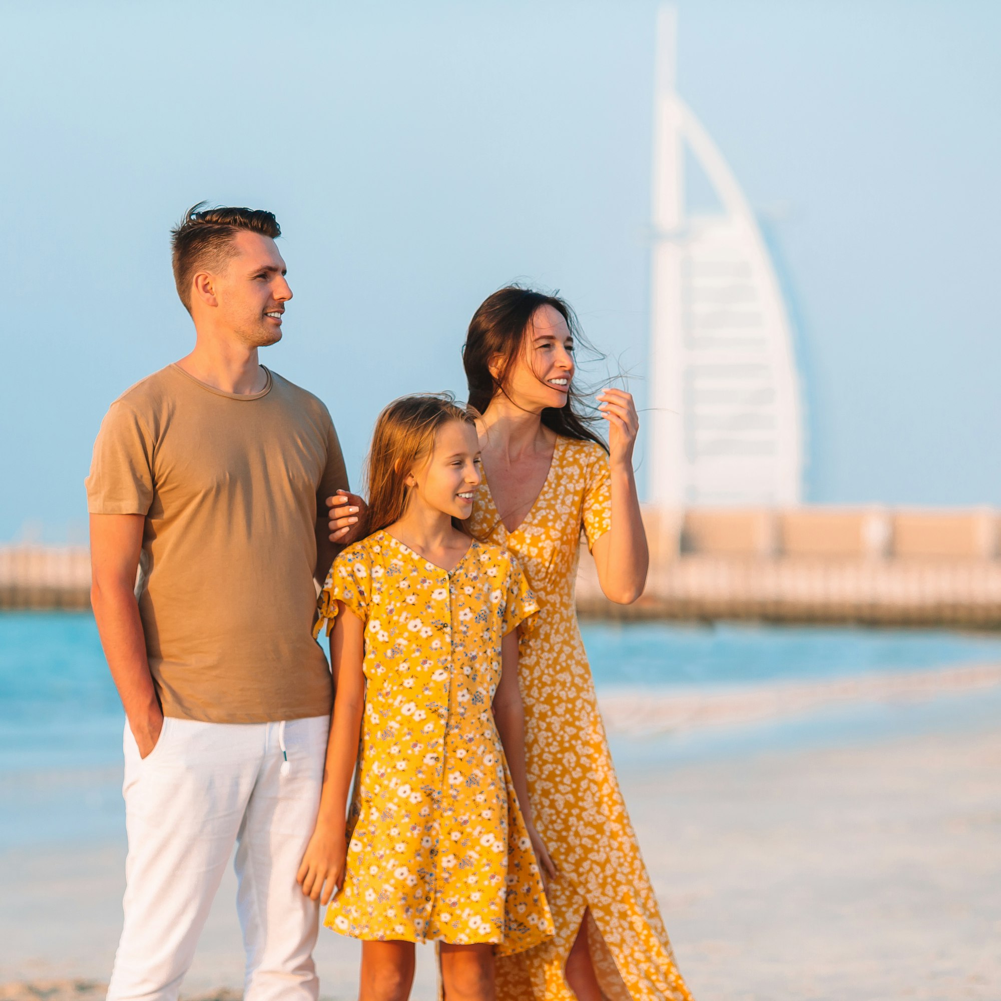 Happy family on the beach during summer vacation