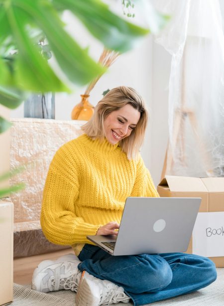 Happy woman working on laptop